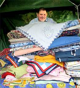 Terrance Gilbert and the latest batch of charity quilts