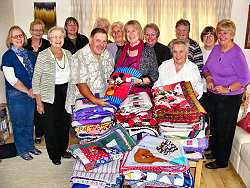 Helping Hands quilt project presentation of charity quilts (photo: Harold Wyld)